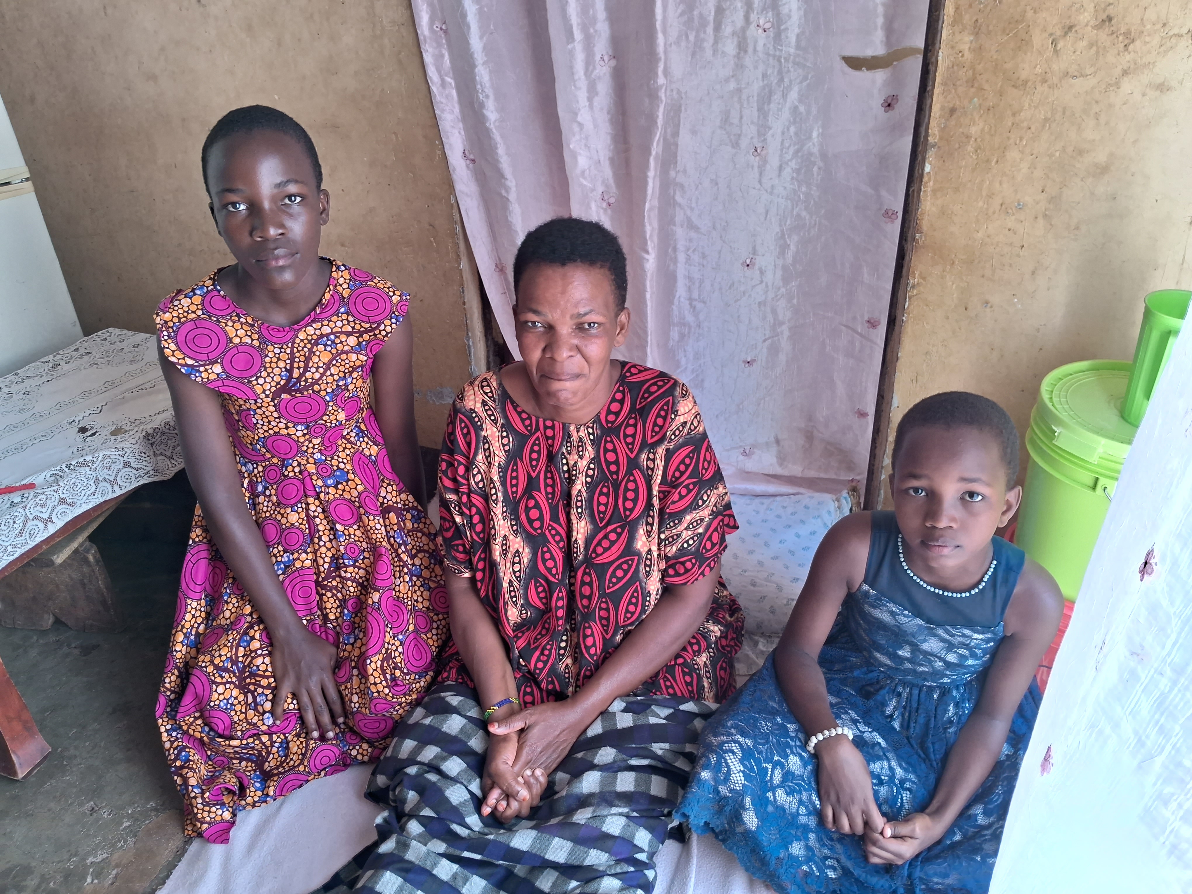 Margreth with her two daughters in their home in Moshi